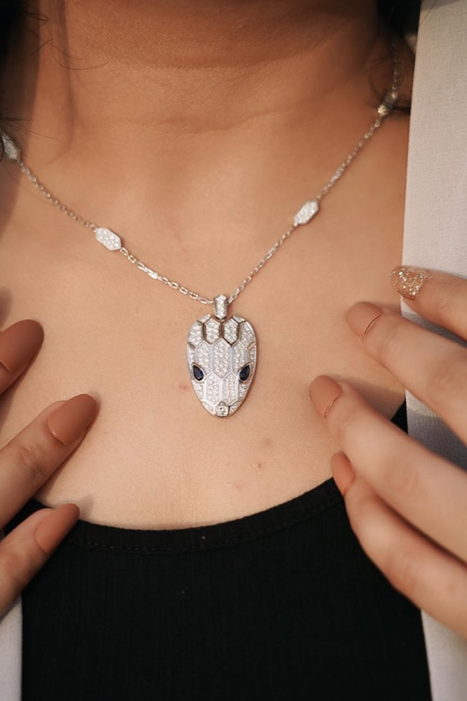 Client wearing a diamond pendant necklace