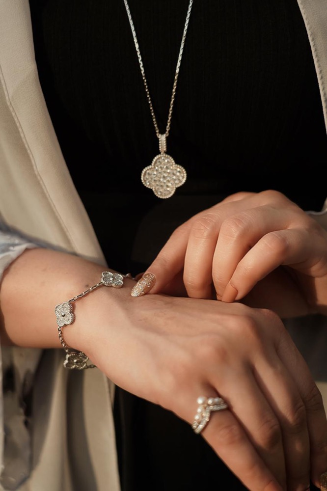 Client wearing a diamond necklace and bracelet